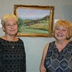 Friends of Art for 2014 was Church of Brethren Home of Windber. AAJ President Kathy Kase Burk is shown with COB home Finance Director Donna Locher in front of the chosen work.
